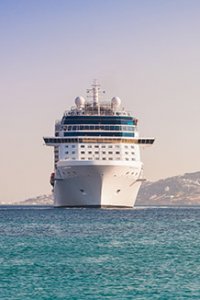 Luxury cruise ship sailing from port - photo courtesy of Natalia Dobryanskaya/Shutterstock