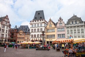 People and stalls at Market square in Trier, Germany